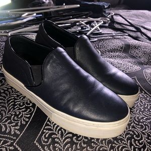 Black slip-on sneakers